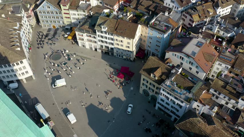 Aerial Pullback Pan Up Reveals Downtown Zurich and Fraumunster Church