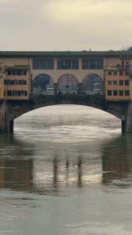View of Ponte Vecchio over the Arno River in Florence, Italy during morning light