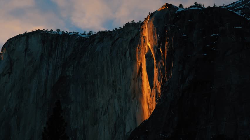 Medium shot of Firefall in Yosemite National Park as it reaches apex.