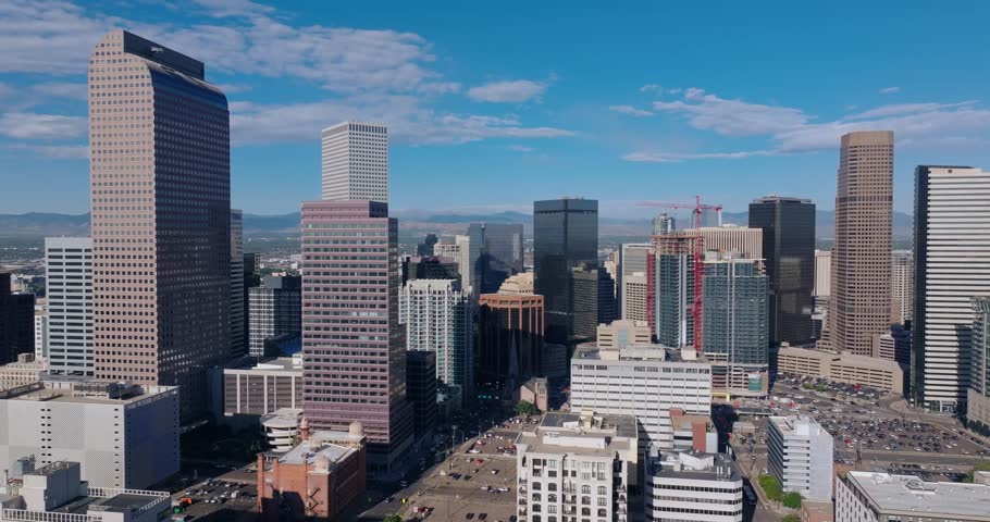 Downtown Denver high rises, tracking right, aerial medium backdrop, Colorado USA