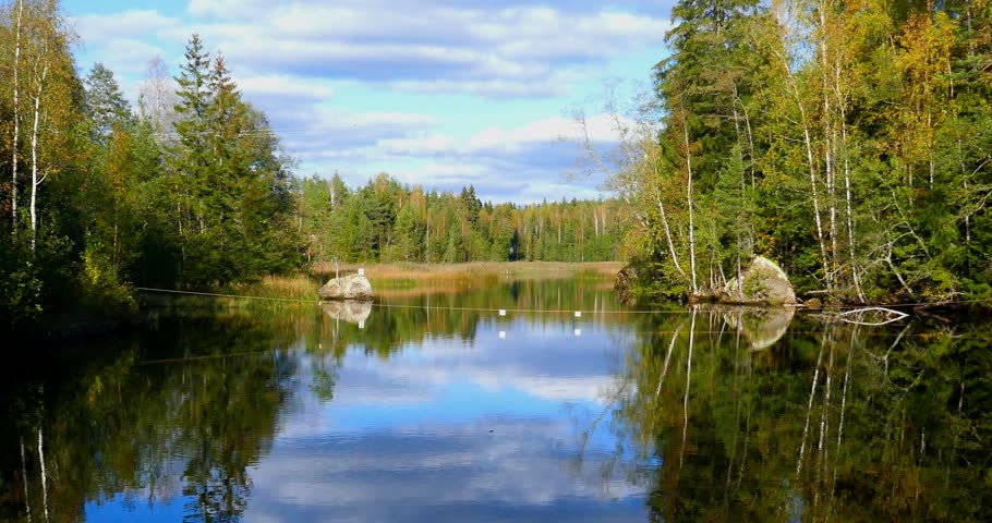 Serene river scene in autumn with clouds in the sky, Ruokokoski, Finland, Europe.