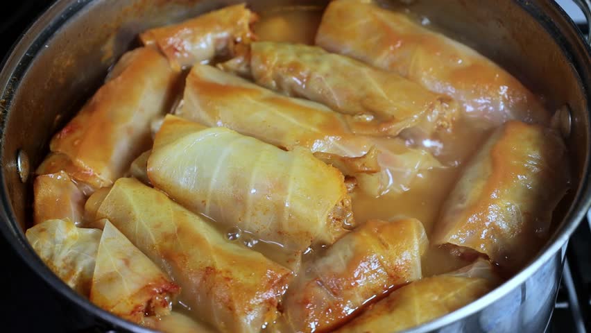 Cabbage rolls are cooked in a saucepan 4k close-up video
