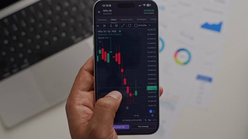 Stock Exchange Broker Analyzing Real-Time Stocks and Exchange Market Charts on Smartphone Using Online Trading App. Investment Agent Working in Office. Close Up.