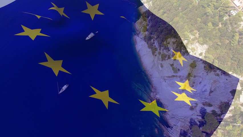 EU flag overlay appearing, waving over bay, stars shifting revealing shoreline, signaling unity. Ensign, translucent, banner, aerial, coastal, harbor, sailboats