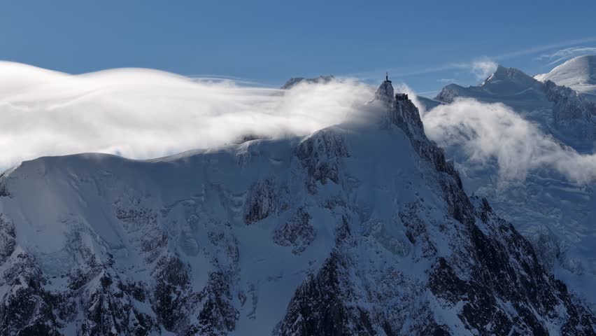 Dynamic clouds sweep over Aiguille du Midi Chamonix France