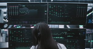 Focused Female Broker Monitoring Global Stock Exchange Indices on Multiple Digital Displays. Concept of Technical Expertise and Intensive Nature of Modern Day Trading From Modern Private Workspaces. - Powered by Shutterstock - Get 15% off with code: PIKWIZARD15