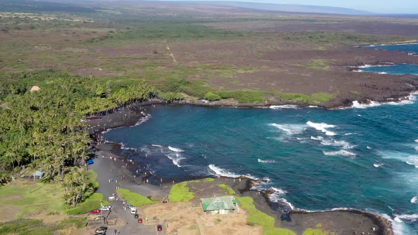 Drone Ascending and Flying Away from Punalu?u Black Sand Beach with Tourists and Palm Trees Big Island Hawaii