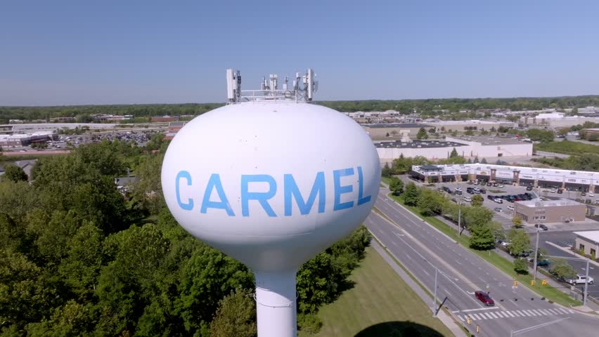 Carmel, Indiana water tower with stable drone pulling back.