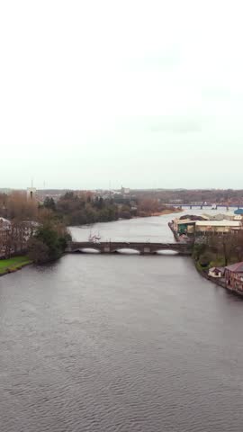 Slow advancing social ratio ratio vertical aerial video of the River Bann in Coleraine, Northern Ireland in the UK. Produced in 1080x1920, 60 frames per second and with Rec709 color.