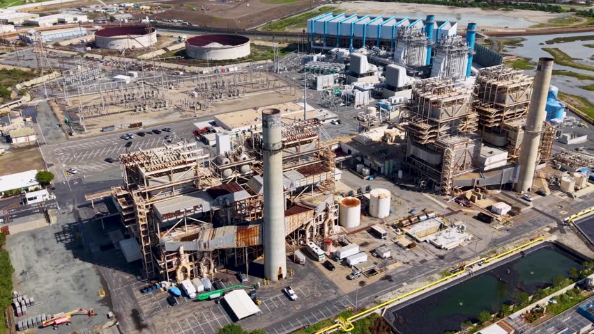 Dramatic aerial view of a rusted Oil Refinery on the Pacific Coast