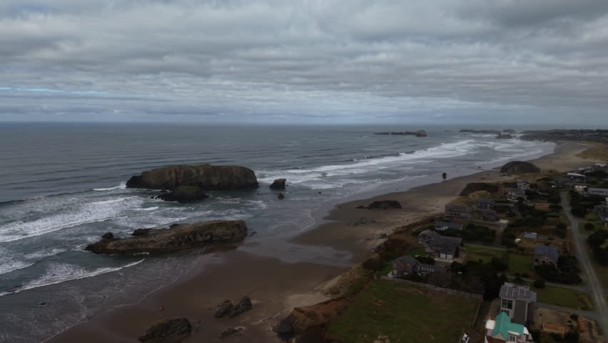 Haystack Rock in Bandon Oregon, one of three at the Oregon Coast. Drone orbit.