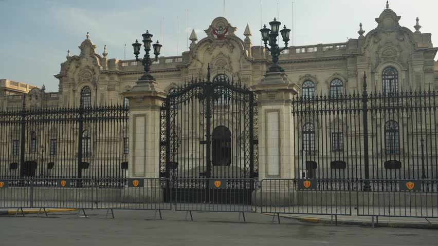 Close up shot of the Presidential Palace of Peru called "Palacio del Gobierno" with their main black gates locked. Recorded early in the morning. Located in "Plaza Mayor" in city center of Lima, Peru.