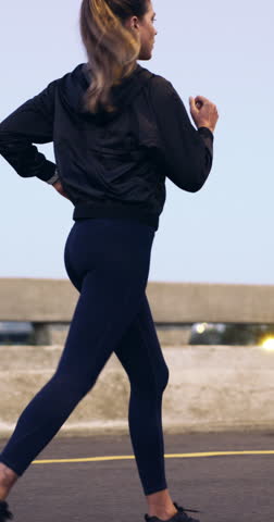 Running, athlete and woman on bridge, training and exercise routine for wellness, active and cardio. City, runner and person with endurance on jog, fitness or workout for health goals and outdoor