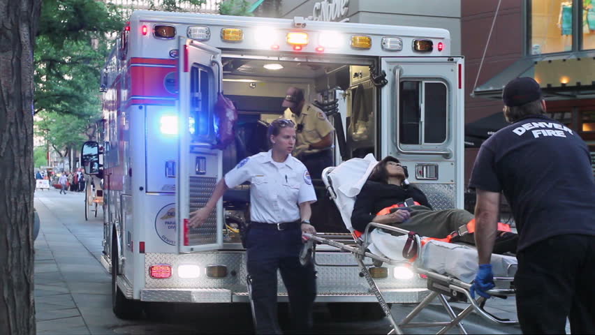 Denver, CO - June 1, 2013: Denver emergency medical response loads a woman into