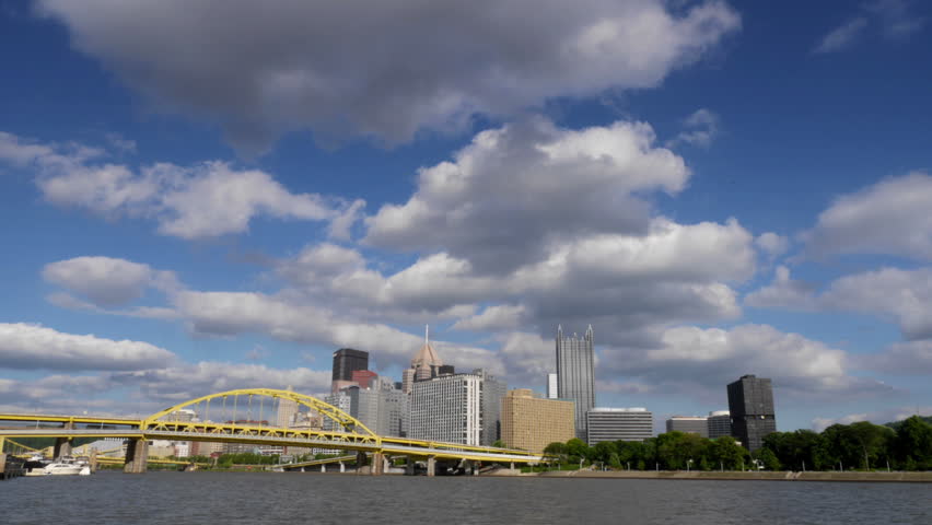 Dramatic time lapse of the Pittsburgh skyline.  Corporate logos have been