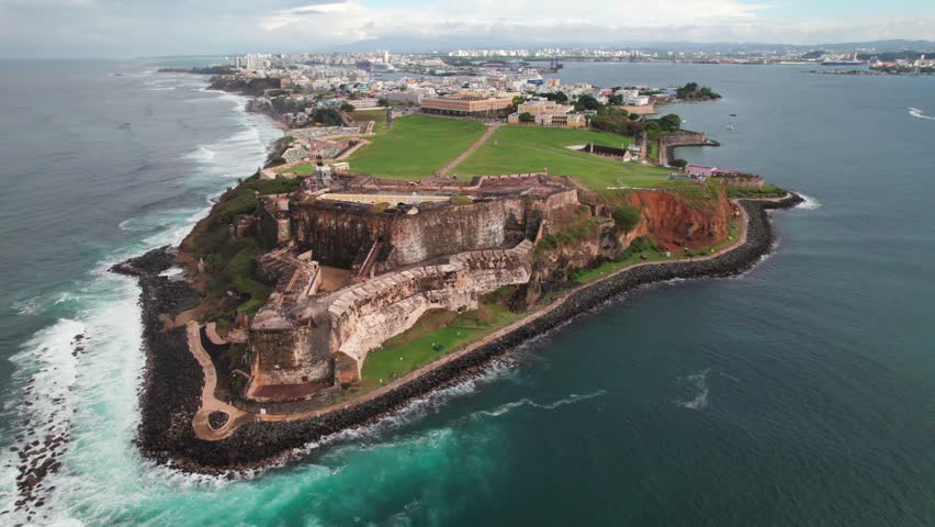 Epic cinematic aerial of Castillo San Felipe Fortress and Park in Old San Juan, Puerto Rico, 4K