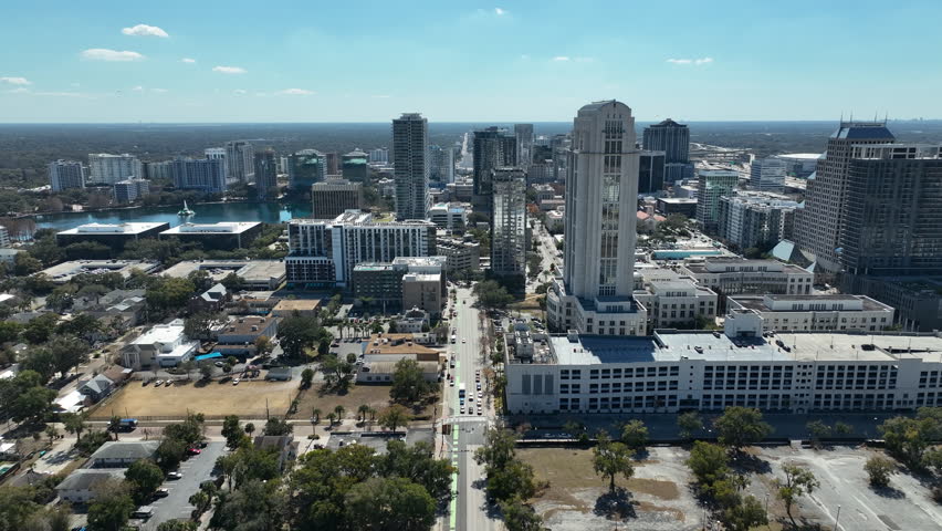 Panning symmetrical drone clip moving from left to right showcasing the Orlando skyline.