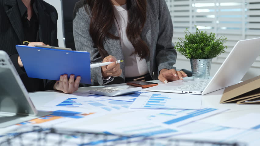 Team businesswoman analyzing financial graphs, calculating company expenses, and planning investments, corporate, accounting, and economic strategy.