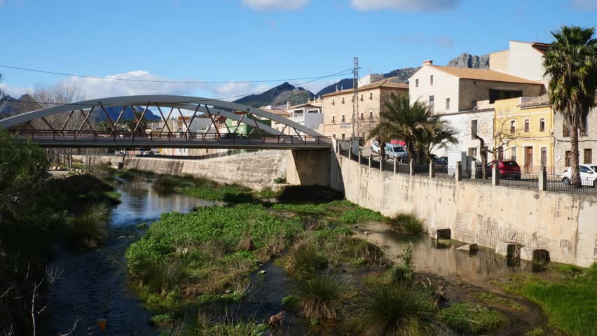 The village of Beniarbeig, Spain. Girona river and Meridian 0 bridge.