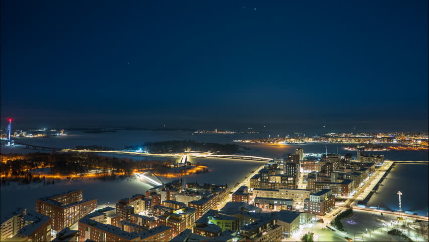 Aerial time-lapse of Kalasatama, islands and Nihti, winter night in Helsinki