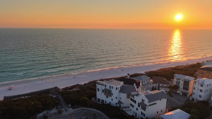 Beautiful golden sunset over Santa Rosa Beach with coastal houses, 30A, Florida, USA