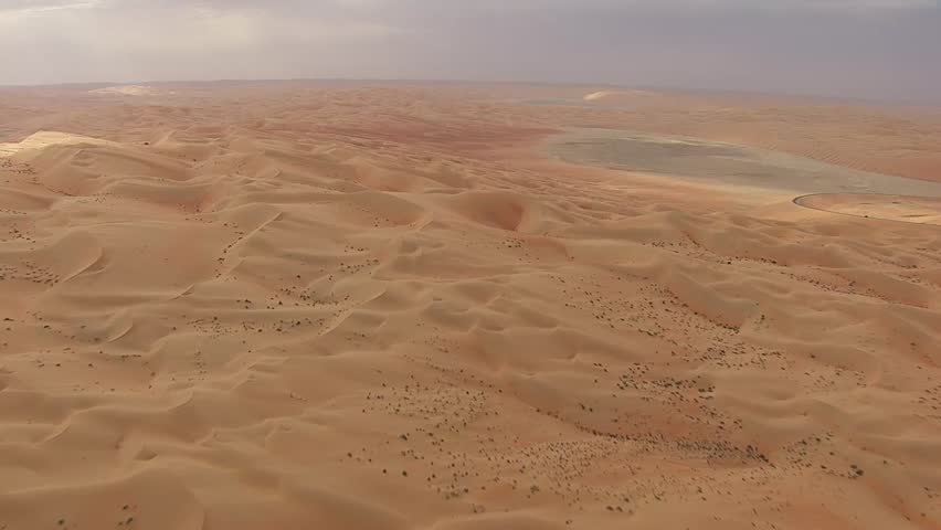 aerial view of majestic sanddunes covert in a red sand as far as the eye can see