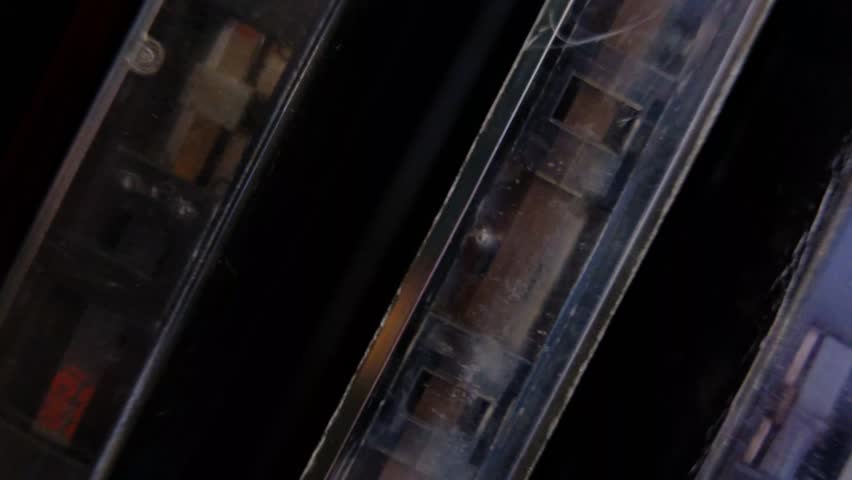vintage retro audio tape cassettes on a rotating table with a dark background