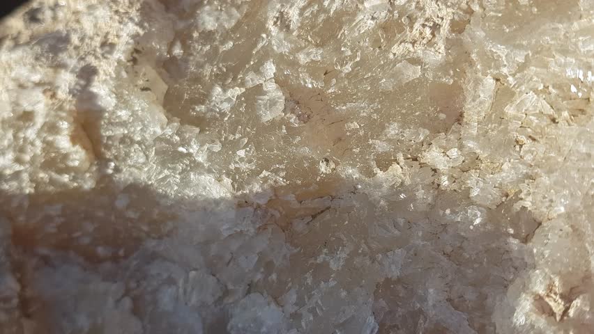 A detailed close-up of raw barite showcases its unique formations and textures, placed in a genuine setting to enhance the mineral