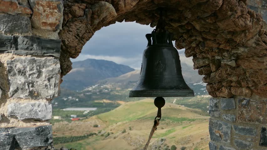 Old church bell with stone frame with mountain and hills view background
