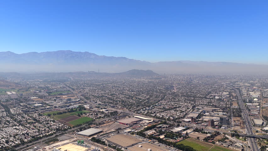 Aerial panoramic view of Santiago city with Andes mountains in background, Chile.