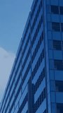 Vertical video: Specks sparking HUD scan, tower showing rings, avatars linking for network scan. Highrise, skyscraper, facade, glass, steel, urban, vertical video - Powered by Shutterstock - Get 15% off with code: PIKWIZARD15
