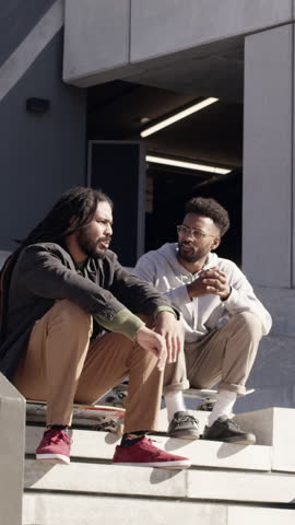 People, handshake and greeting at skatepark with smile, conversation and bonding together on weekend. Happy, skateboarder friends and shaking hands outdoor with hello, talk and relax before skating.