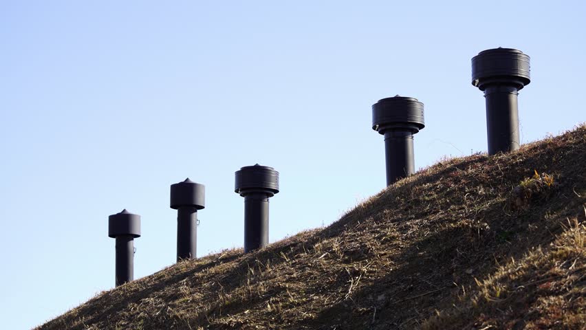 A row of ventilation pipes stands as a quiet reminder of the past at the Toyokawa Naval Shipyard Peace Park