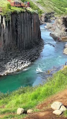 Turquoise River Flowing Through Dramatic Basalt Column Canyon