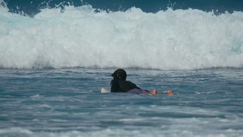 Surfer Paddling Through Powerful Breaking Waves Dark Wetsuit Silhouette Battles Shorebreak Foam, Surfboard