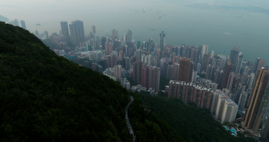 Hong Kong Skyline Seen From The Victoria Peak Viewpoint At Sunset. Aerial Shot