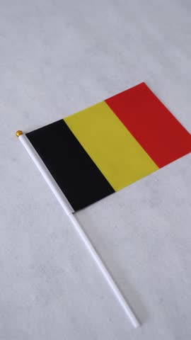 Belgium flag on white background. Vertical close up shot. Belgian national flag.