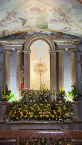 Church interior with altar and flowers, Santuario de Guadalupe in Morelia
