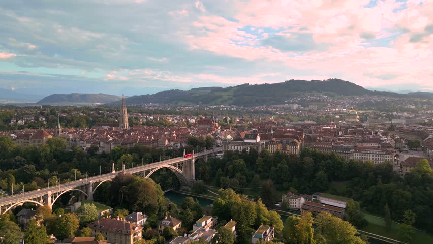 Bern, Switzerland city view and bridge with early autumn foliage.