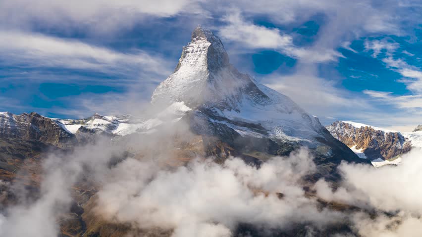 Zermatt, Switzerland with the Matterhorn mountain peak with cloud cover.