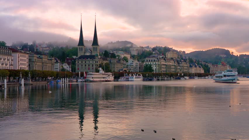 Lucerne, Switzerland with the Church of St. Leodegar at dawn.