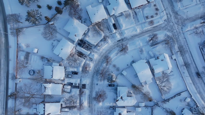 Snow-covered homes in Mississauga from above during winter season