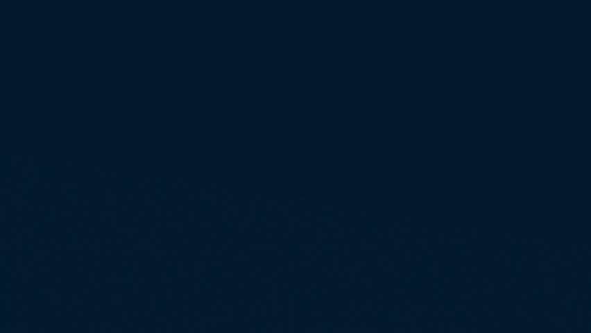 A calm night scene showing a deep blue sky with subtle gradient and soft cloud lines moving gently across the frame creating a serene atmosphere