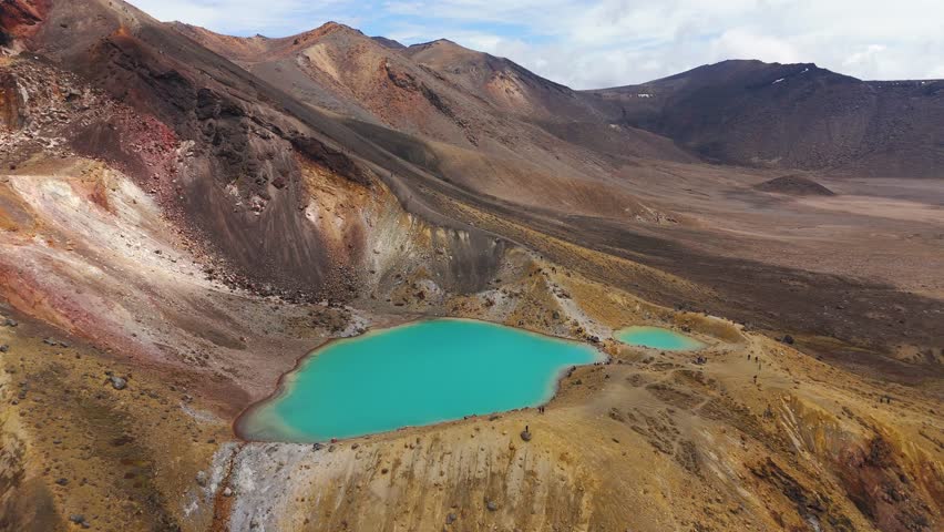 Aerial view of volcanic terrain and crater lakes at Tongariro Alpine Crossing