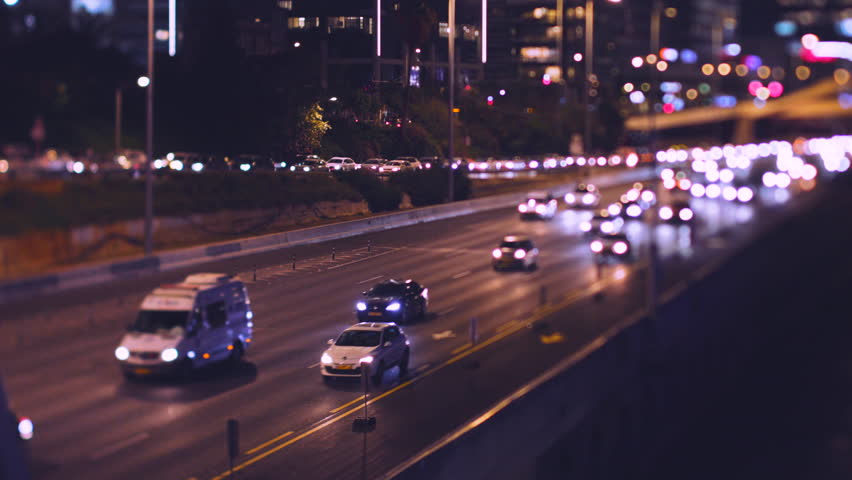 Night traffic on the road. Tel Aviv, Israel, Ayalon Highway. The city at night.