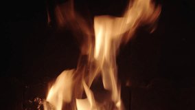 Flames dancing in rhythmic motion under night sky fire pit glow - Powered by Shutterstock - Get 15% off with code: PIKWIZARD15