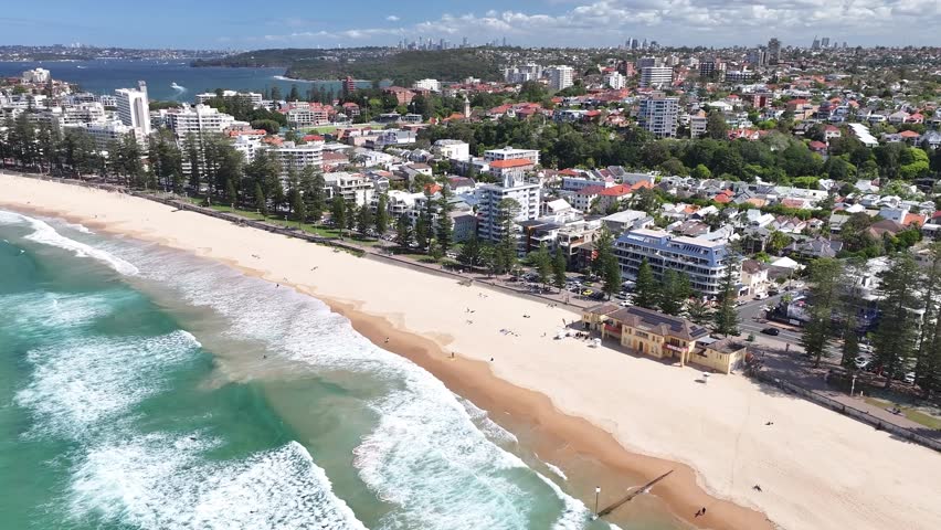 Long sandy Manly Beach in Sydney. Aerial cityscape, coastal city Australia. Lifestyle
