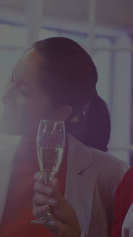 Vertical video: Mature woman holding flute graphic appearing over her expanding mapping biz network. Champagne, conversation, overlay, icons, dessert, reception, vertical video