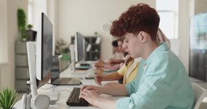 Students and teacher in classroom coding lesson. Focused teenagers code at computers as instructor guides. Modern lab supports collaboration. Concept highlights digital education and teamwork. - Powered by Shutterstock - Get 15% off with code: PIKWIZARD15
