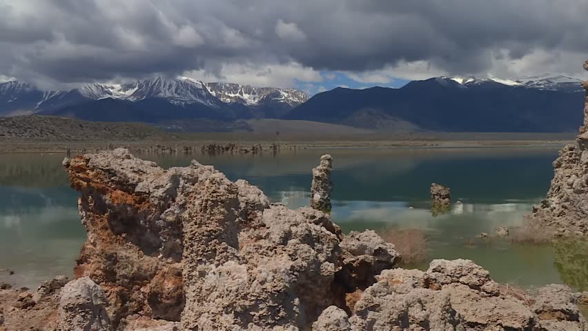 Static shot of Mono Lake with tufa spires and snowy Sierra Nevada mountains, USA